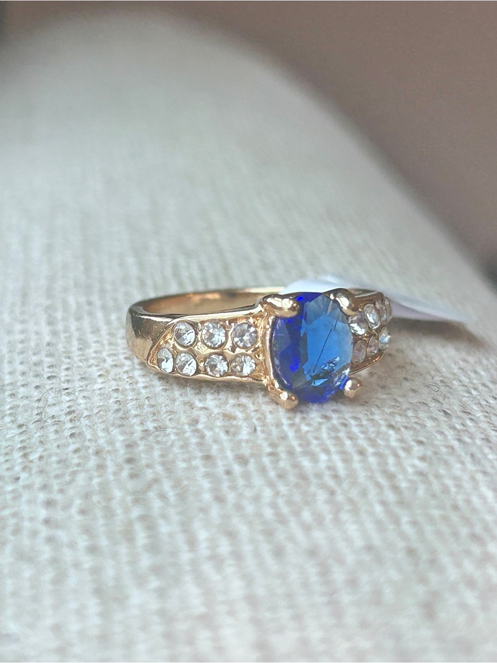 Gold Ring with Oval Blue Gem and Accent Crystals - size 7